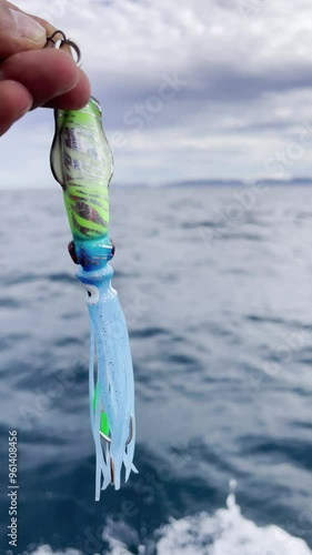 Angler prepares fishing bait. Fish lure. Fish and fishery concept.