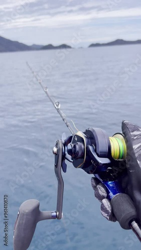 Angler are fishing in the sea using a boat. Fishing Reels Rods. Fish and fishery concept.