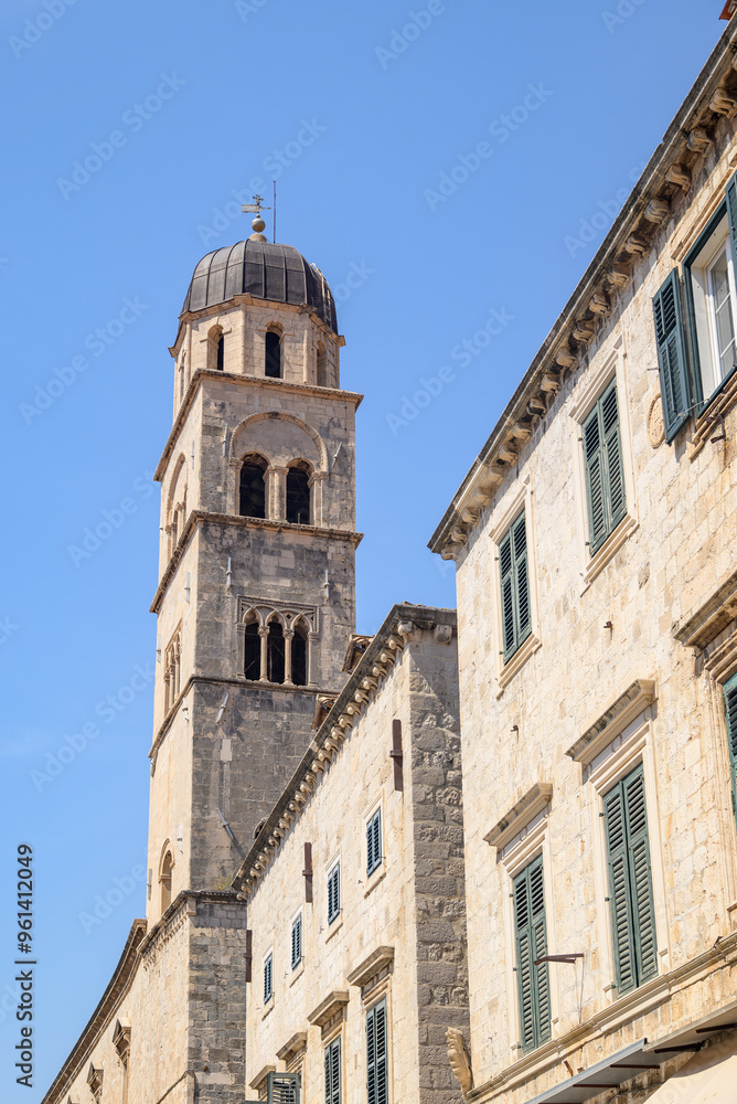Church and bell tower of the Franciscan friary situated at the Stradun, the main street of Old town Dubrovnik in Croatia Church and bell tower of the Franciscan friary situated at the Stradun, the main street of Old town Dubrovnik in Croatia