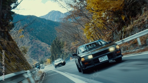 Black Car Driving on Winding Mountain Road in Japan