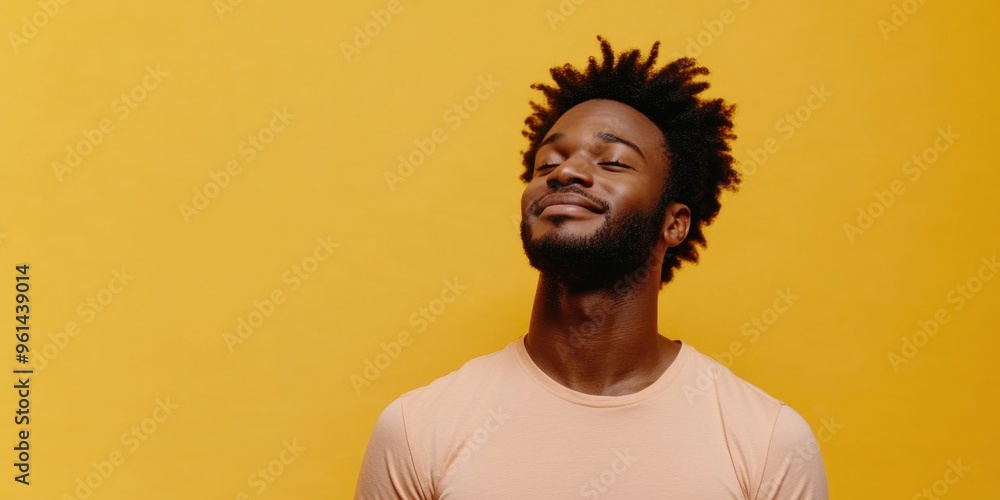 Obraz premium Happy Man in Yellow Background