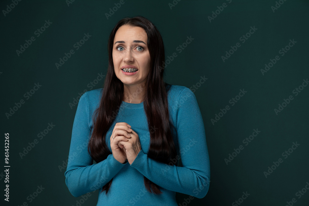 Fototapeta premium Woman Standing With Folded Hands