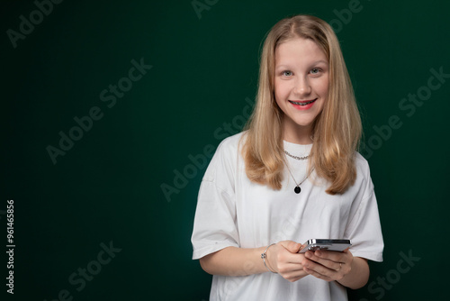 Woman in White Shirt Holding Cell Phone