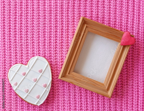 Cozy Pink Mockup Invitation Card. Knitted Textured Background. Cute Baby Template. Valentine Conception. Wooden Frame. Heart Shape Cookie. Vintage Photo photo