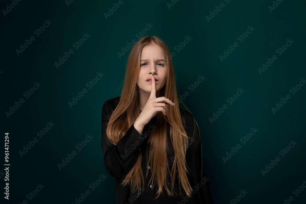 Woman With Long Red Hair in Front of Green Wall Woman With Long Red Hair in Front of Green Wall
