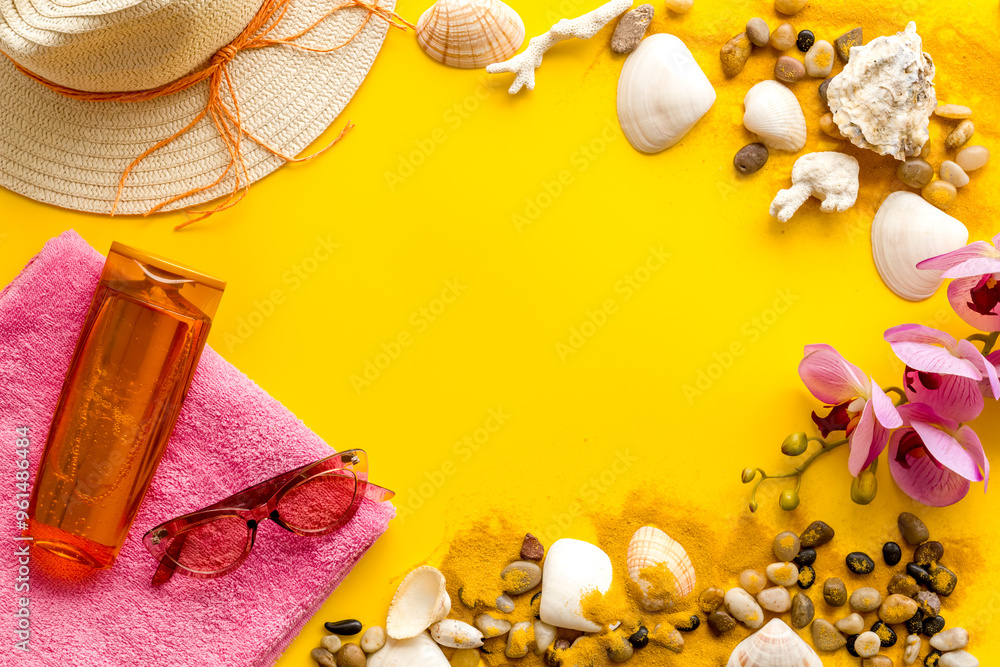 Summer beach background with shells and sea sand with sunbathe accessories, top view Summer beach background with shells and sea sand with sunbathe accessories, top view