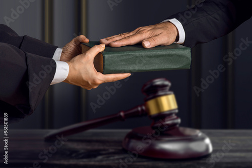 Wallpaper Mural Hand on the Bible in court or the oath on the constitution book. The witness is sworn in Torontodigital.ca