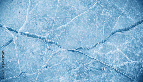 Abstract natural ice texture. Freezy ice surface. Blue backdrop with cracks and scratches on frozen water. Banner. for text; background vintage toning