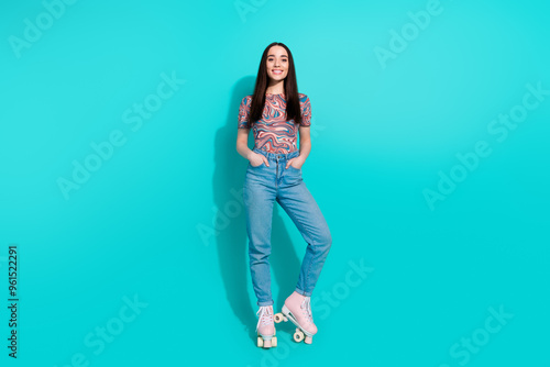 Full length photo of charming girly woman wear print shirt riding rollers empty space isolated turquoise color background