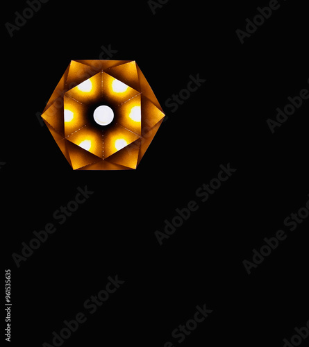 Illustration of an abstract polygonal lamp on a black background