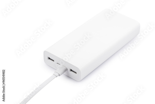 Powerbank for charging mobile devices with cable on white table