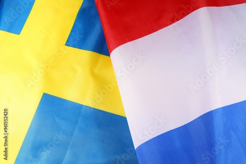 Sweden and Netherlands flags in vibrant colors together.  photo