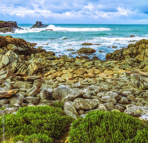 Gemstone beach, Orepuki, New Zealand, South Pacific ocean windy natural coast photo