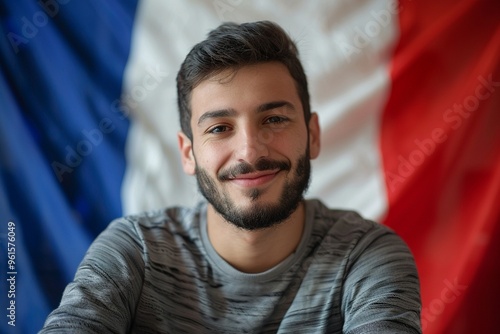 Protests Erupt Over French Immigration Policies. Afghan man stands confidently france flag green scenery. Shot represents colorful celebration of diversity and ethnic roots.