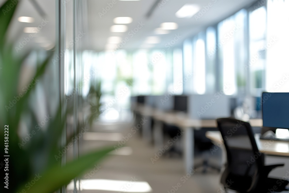 A modern, bright office space with a blurred focus. The scene includes desks, A modern, bright office space with a blurred focus. The scene includes desks,