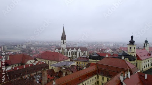 Wallpaper Mural Approaching a church in Sibiu, Romania, amidst rain and dense fog. Torontodigital.ca