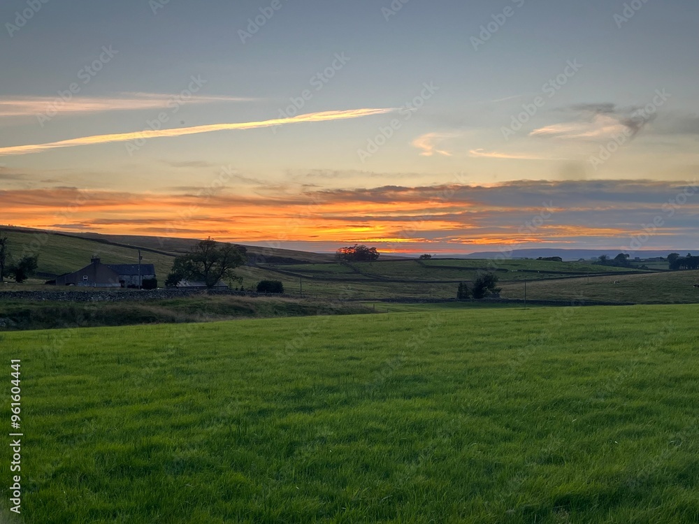Fototapeta premium View of a sunset beyond the countryside