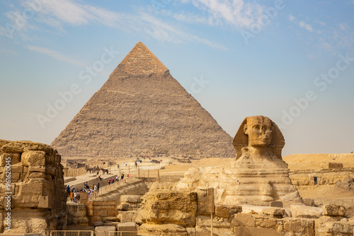 Beautiful profile of the Great Sphinx including pyramids of Menkaure and Khafre in the background on a clear sunny, blue sky day in Giza, Egypt