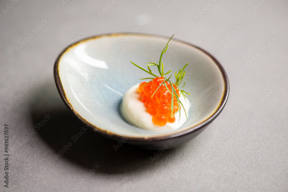 red caviar on creme fraiche with dill