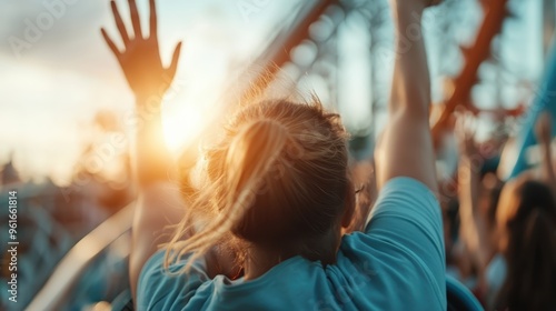 This image shows a person on a roller coaster with hands raised, captured at sunset, evoking feelings of joy, freedom, and excitement. The background shows more riders.