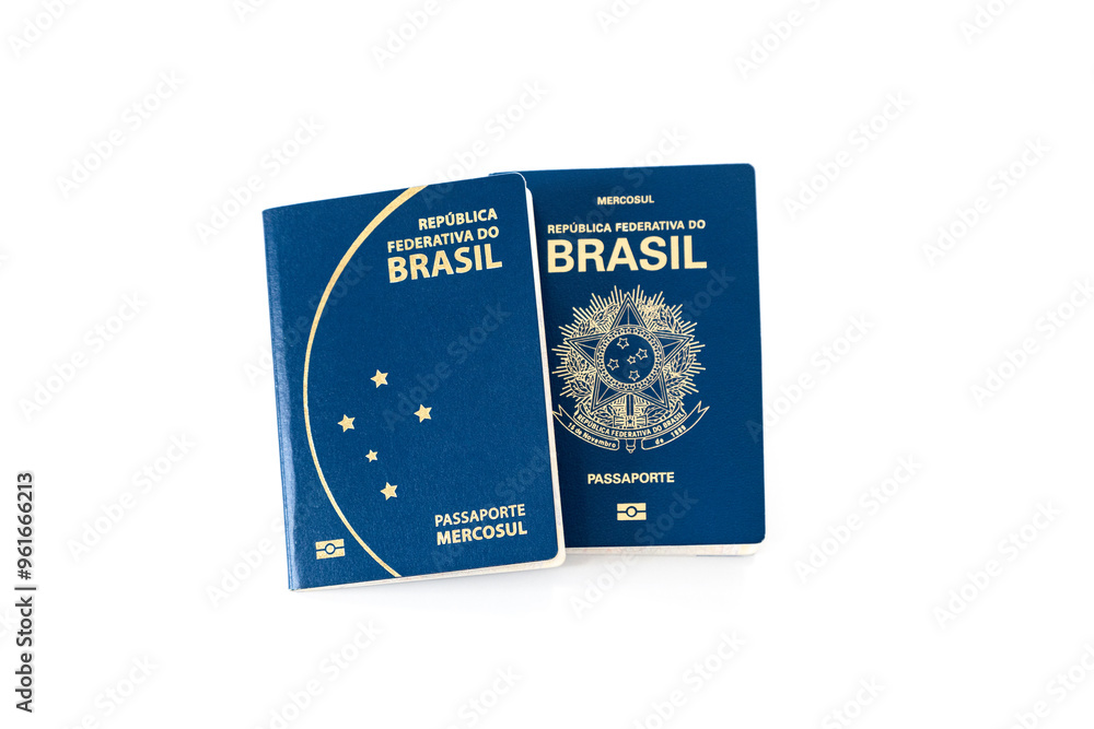 Two different models of Brazilian passport on a white background Two different models of Brazilian passport on a white background