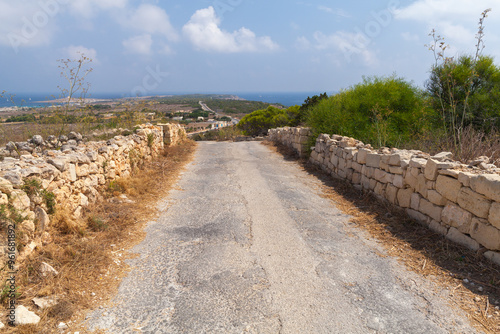 Malta landscape with an empty road to Mellieha