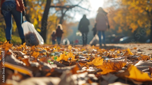 Volunteers are seen cleaning a park on a sunny autumn day, with fallen leaves covering the ground. The scene captures the essence of teamwork, environmental responsibility, and community engagement.