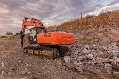 Excavator making earth movements for the construction of a road