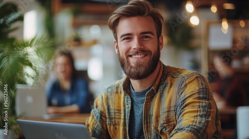 Man Working on Laptop in Coffee Shop