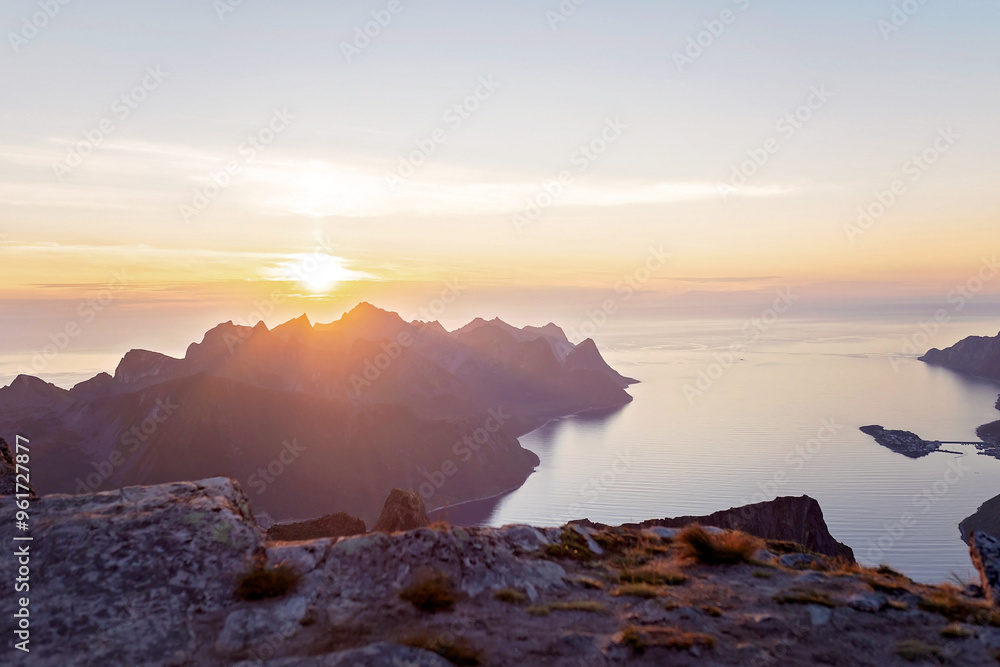 Obraz premium Children and adults, family with dog, hiking Grytetippen trail in Senja, Lofoten on a sunny summer day