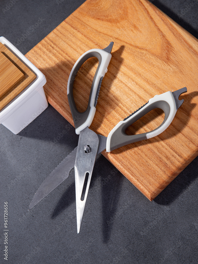 kitchen iron scissors on a wooden cutting board kitchen iron scissors on a wooden cutting board