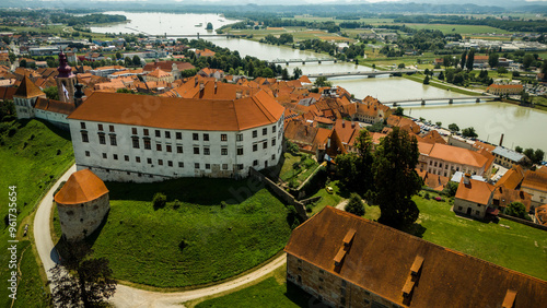 Aerial drone view of Ptuj townscape in Slovenia by river Drava photo