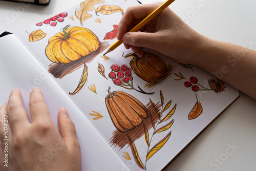 Hand coloring autumn illustration with markers