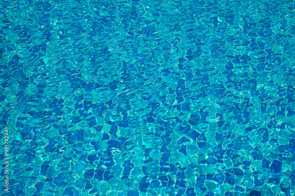Swimming Pool Surface With Light Reflection and Water Ripple Patterns Swimming Pool Surface With Light Reflection and Water Ripple Patterns
