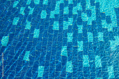 Swimming Pool Surface With Light Reflection and Water Ripple Patterns photo