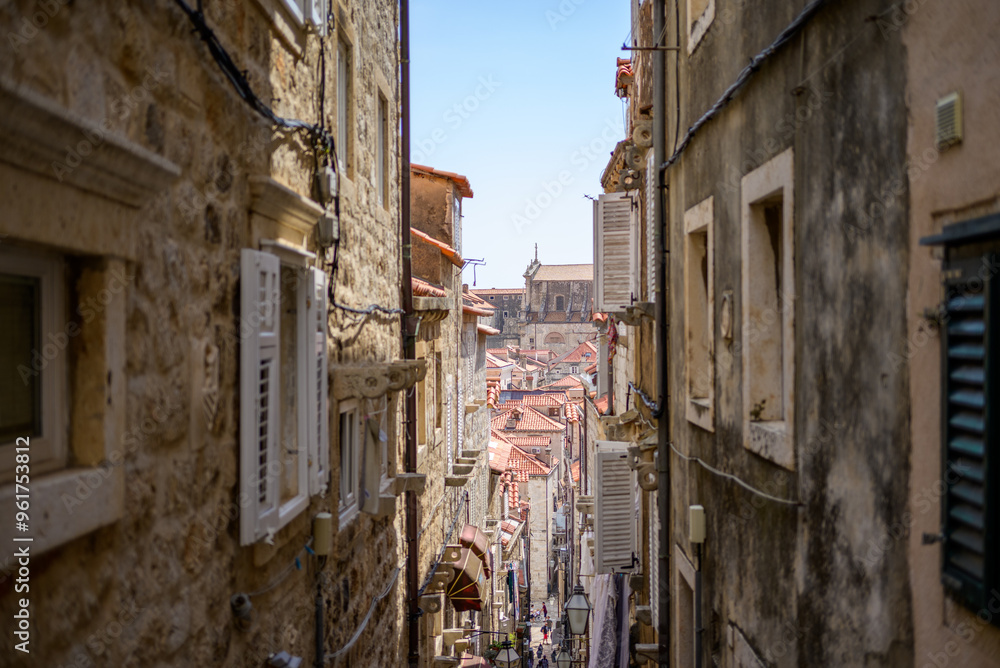 Staircased narrow cobblestone alley in the medieval old town of Dubrovnik in Dalmatia, Croatia Staircased narrow cobblestone alley in the medieval old town of Dubrovnik in Dalmatia, Croatia