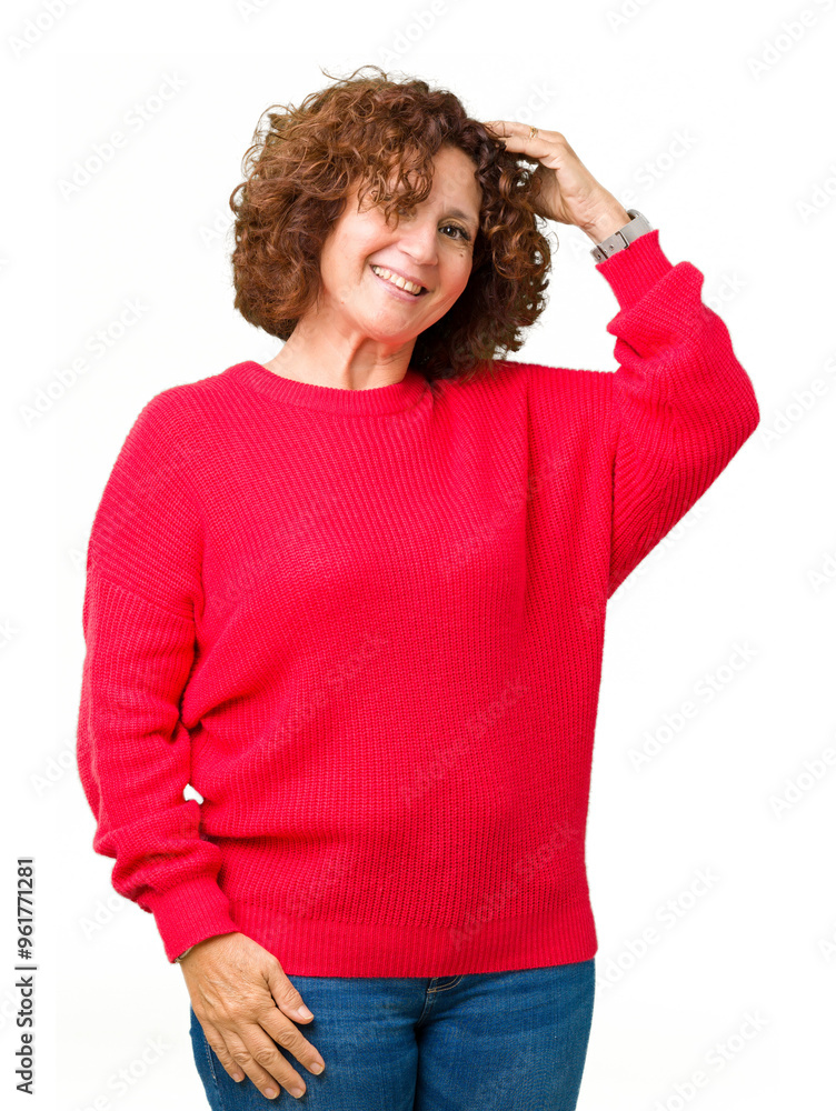 Beautiful middle ager senior woman red winter sweater over isolated background Smiling confident touching hair with hand up gesture, posing attractive Beautiful middle ager senior woman red winter sweater over isolated background Smiling confident touching hair with hand up gesture, posing attractive