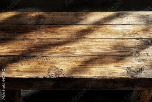 Sunbeams Dance on Weathered Wood: A Rustic Tabletop Beckons. photo