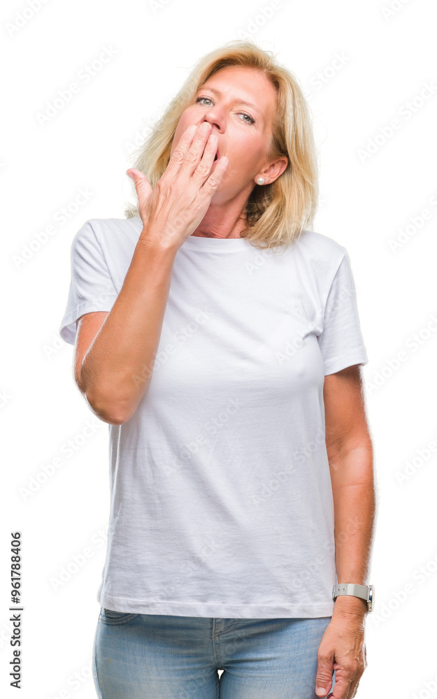 Middle age blonde woman over isolated background bored yawning tired covering mouth with hand. Restless and sleepiness. Middle age blonde woman over isolated background bored yawning tired covering mouth with hand. Restless and sleepiness.