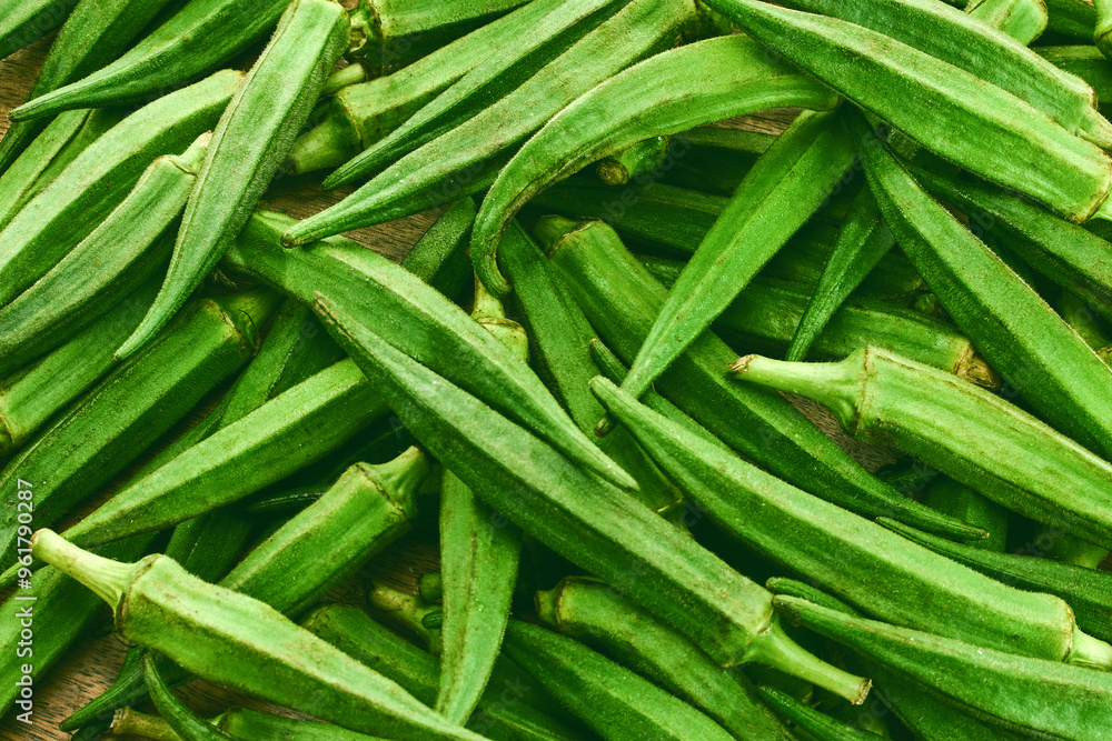Fresh Okra Pods on wooden background Fresh Okra Pods on wooden background
