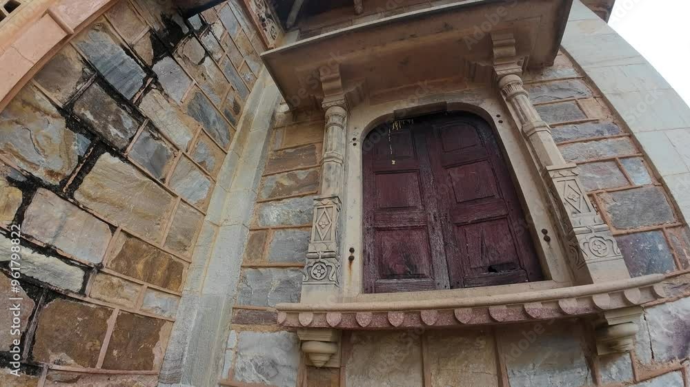 Exploring intricate architecture of an ancient stone building with detailed wooden windows Exploring intricate architecture of an ancient stone building with detailed wooden windows