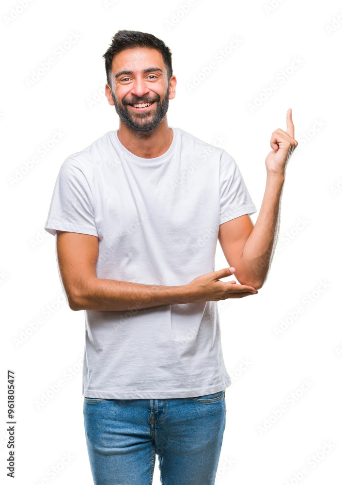 Adult hispanic man over isolated background with a big smile on face, pointing with hand and finger to the side looking at the camera. Adult hispanic man over isolated background with a big smile on face, pointing with hand and finger to the side looking at the camera.