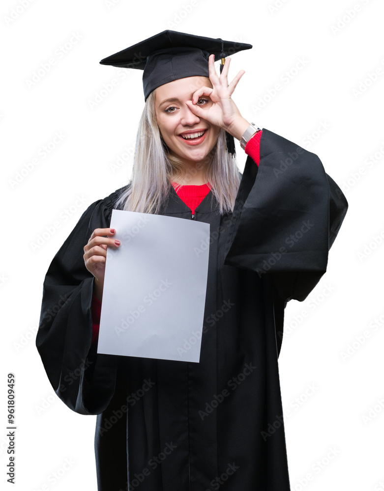 Young blonde woman wearing graduate uniform holding degree over isolated background with happy face smiling doing ok sign with hand on eye looking through fingers Young blonde woman wearing graduate uniform holding degree over isolated background with happy face smiling doing ok sign with hand on eye looking through fingers