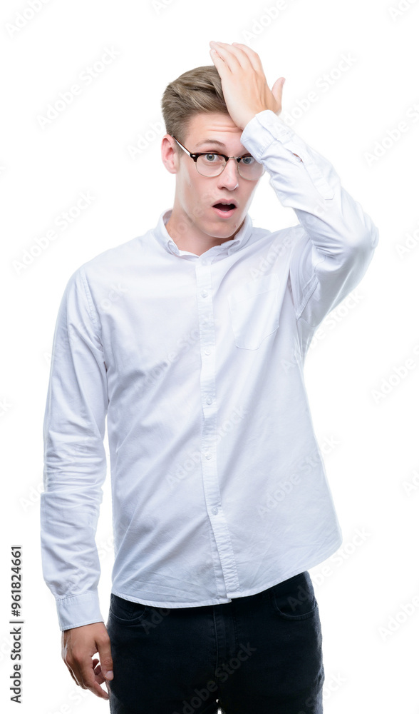 Young handsome blond man surprised with hand on head for mistake, remember error. Forgot, bad memory concept. Young handsome blond man surprised with hand on head for mistake, remember error. Forgot, bad memory concept.