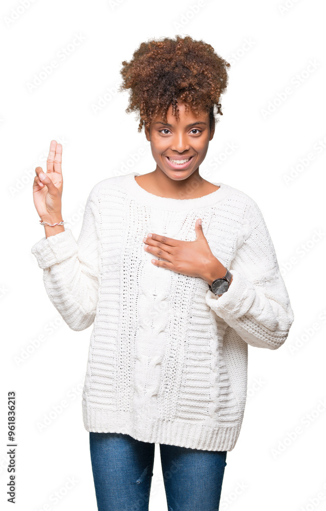 Beautiful young african american woman wearing winter sweater over isolated background Swearing with hand on chest and fingers, making a loyalty promise oath Beautiful young african american woman wearing winter sweater over isolated background Swearing with hand on chest and fingers, making a loyalty promise oath