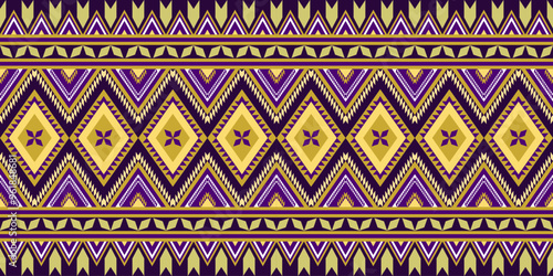 Abstract ethnic seamless pattern in yellow, gold and purple  color. Geometric tribal, folklore embroidery ornament art pattern design for textile, texture, fabric, background, cover, carpet, printing.