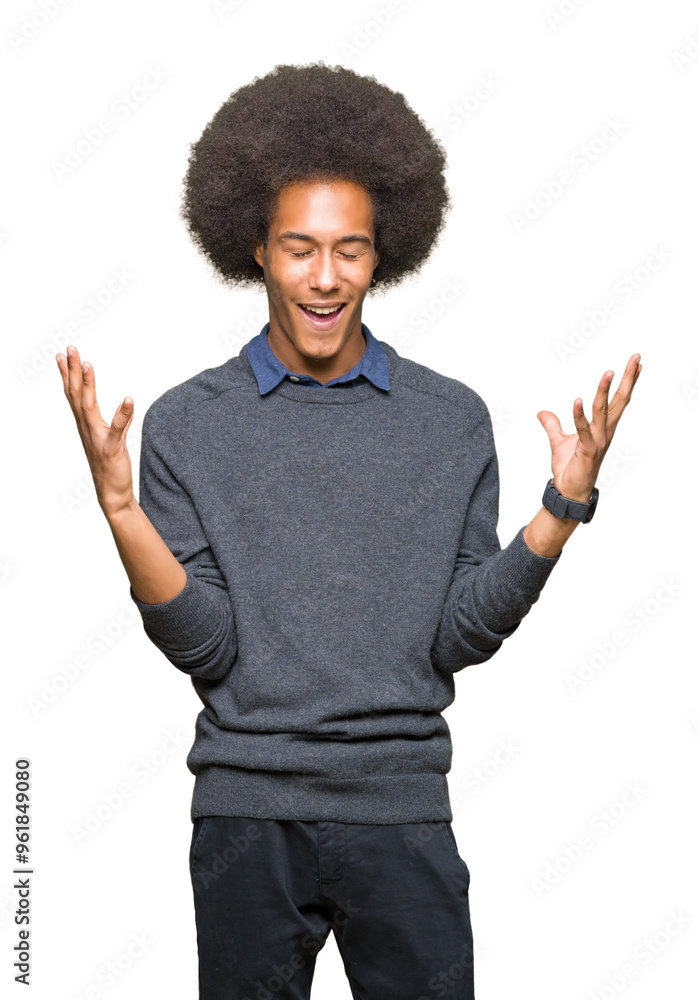 Young african american business man with afro hair celebrating mad and crazy for success with arms raised and closed eyes screaming excited. Winner concept Young african american business man with afro hair celebrating mad and crazy for success with arms raised and closed eyes screaming excited. Winner concept
