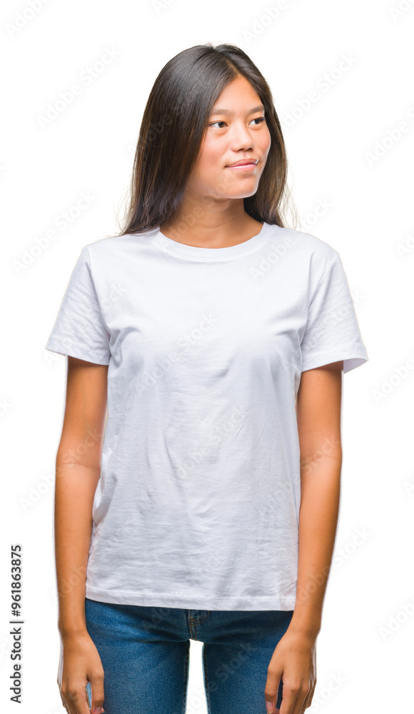 Young asian woman over isolated background smiling looking side and staring away thinking. Young asian woman over isolated background smiling looking side and staring away thinking.