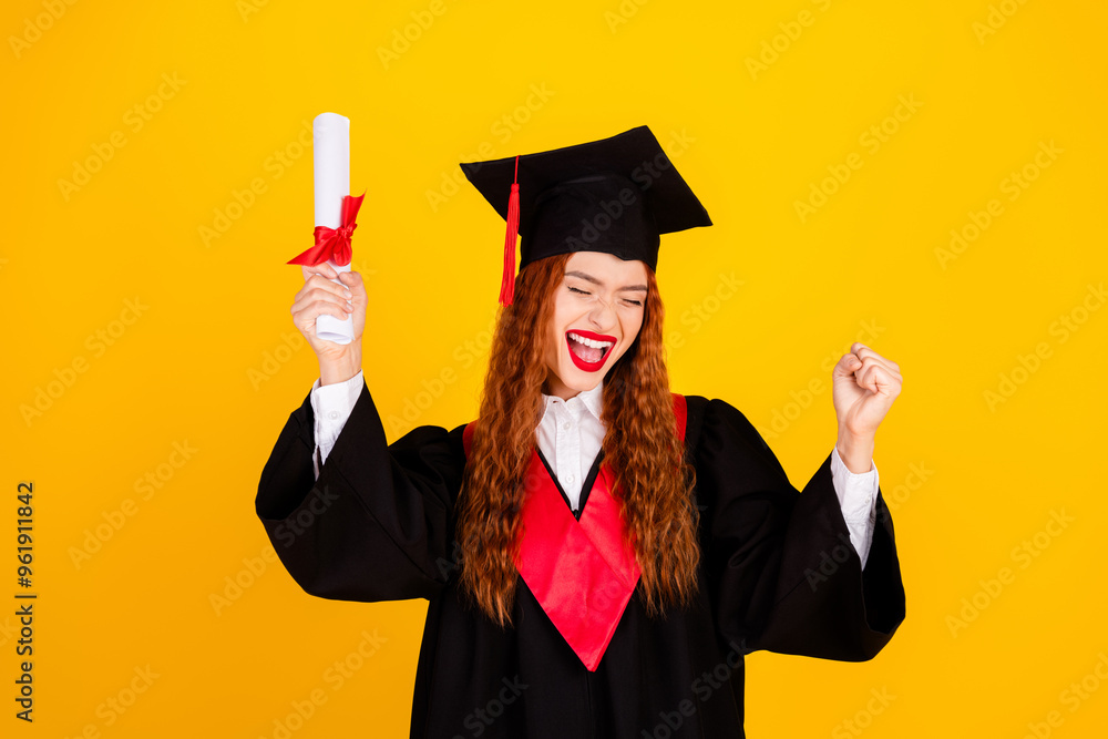 Photo of glad charming girl graduate wear black mantle complete college isolated on yellow color background Photo of glad charming girl graduate wear black mantle complete college isolated on yellow color background