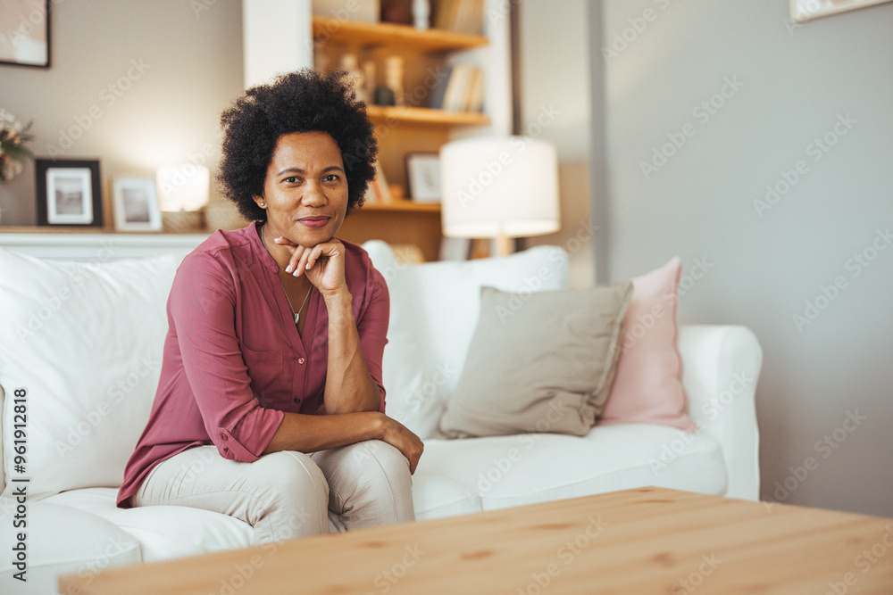 Relaxed Woman Sitting on Comfortable Sofa at Home Relaxed Woman Sitting on Comfortable Sofa at Home